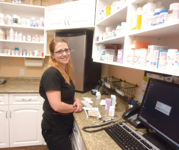 Theresa preparing prescriptions in the pharmacy